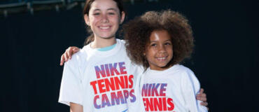 Tennis grils smiling